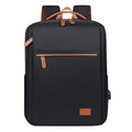 Stylish black travel backpack with brown leather accents and USB port for modern commuters
