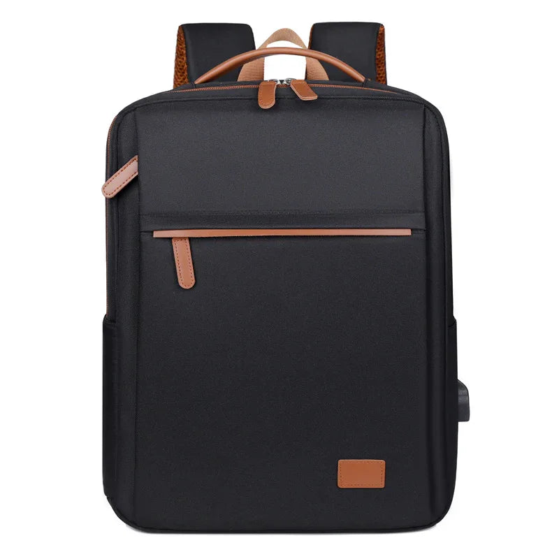 Stylish black travel backpack with brown leather accents and USB port for modern commuters