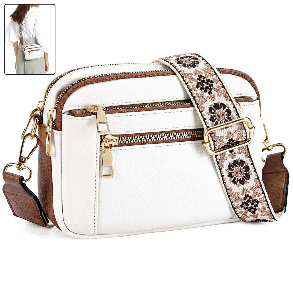 White crossbody bag with floral strap, gold zippers, and brown accents for women's fashion
