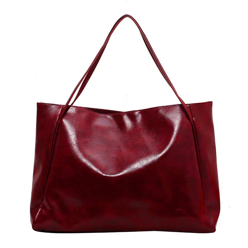 Deep red leather tote bag for women, stylish and spacious shoulder bag for everyday use
