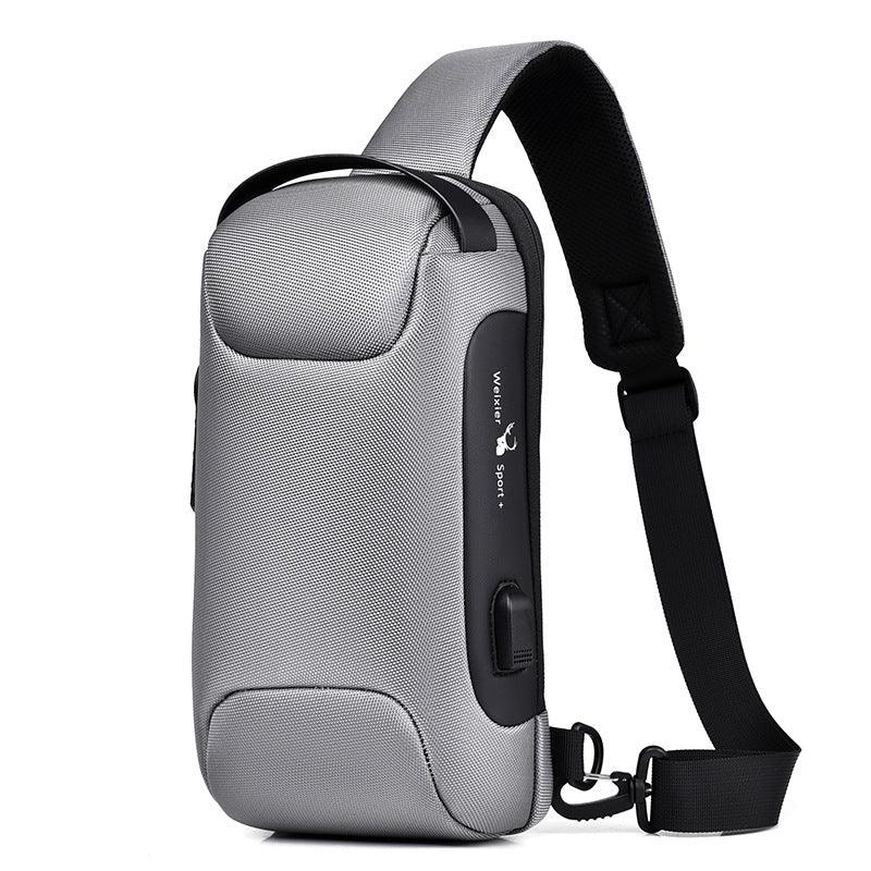 Gray compact travel bag with black strap, designed for wrinkle-free packing and stylish everyday use.