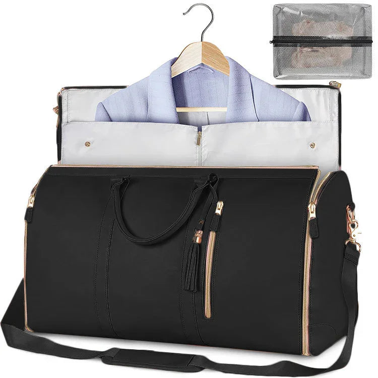 Black travel duffel bag with gold zippers, holding a suit on hanger, includes mesh packing cube for organized trips