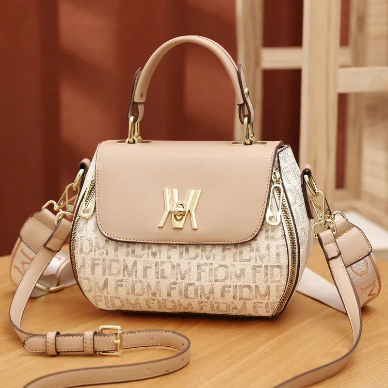 Beige designer handbag with monogram pattern, gold hardware, and detachable strap for women's fashion