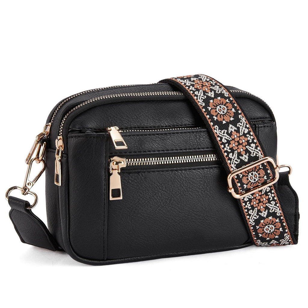 Black crossbody bag with floral strap, gold zippers, and multiple pockets for women’s fashion