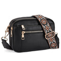Black crossbody bag with floral strap, gold zippers, and multiple pockets for women’s fashion