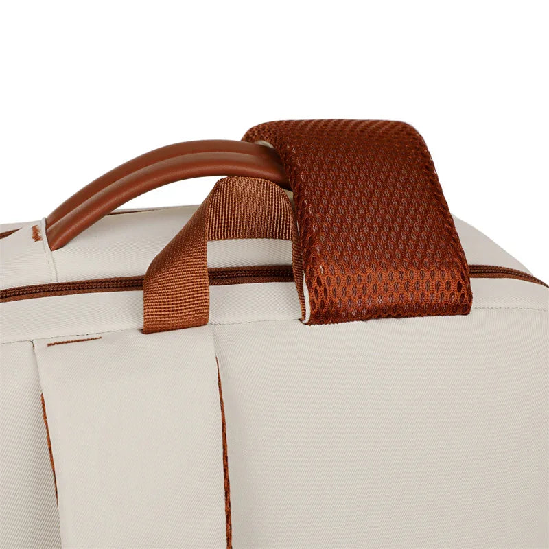 Cream travel bag with brown mesh handle and durable stitching for stylish, wrinkle-free journeys