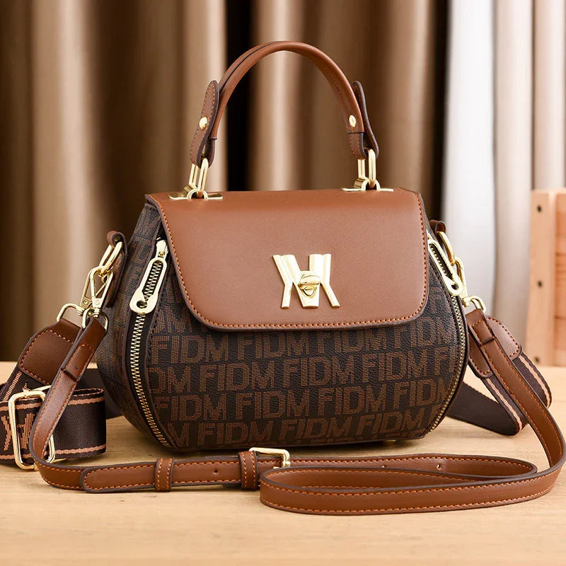 Brown women's designer handbag with monogram print, gold hardware, and detachable strap for fashion travel