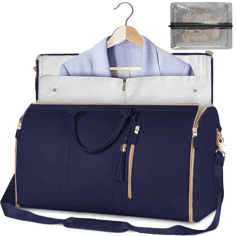 Navy blue travel duffel bag with gold zippers, hanger compartment for wrinkle-free clothes, and mesh packing cube